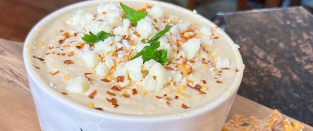 Homemade Hummus is a cinch to make! Once you make your own, you will never buy store bought again! Not to mention, this Queso Hummus will quickly become a household favorite! 